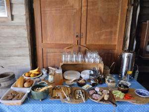 a table with many different types of food on it at Gierszówka in Gietrzwałd