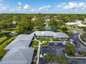an aerial view of a house with a parking lot at Luxurious Golf Retreat Villa in PGA National! in Palm Beach Gardens