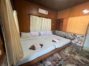 Voodi või voodid majutusasutuse Tongta Phaview Resort toas