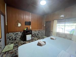 Voodi või voodid majutusasutuse Tongta Phaview Resort toas
