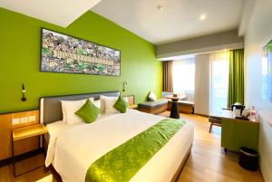 Letto o letti in una camera di RV Hotel Gianyar