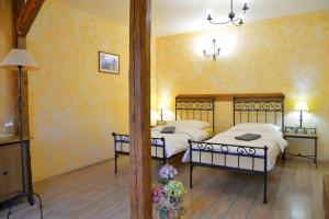 Posteľ alebo postele v izbe v ubytovaní Hotel Via Ironia