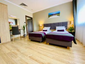 Posteľ alebo postele v izbe v ubytovaní Hotel CONRAD Comfort