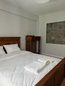 a bedroom with a bed with white towels on it at Machka Resort in Trabzon