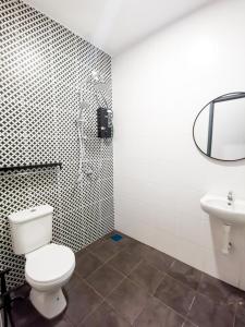 a bathroom with a toilet and a sink at SORANOS HOMESTAY TAMBUN in Ipoh