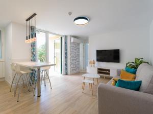 A television and/or entertainment centre at Olas Suites Playa del Ingles