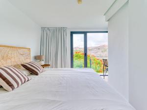 Łóżko lub łóżka w pokoju w obiekcie Salobre Villas Lagos
