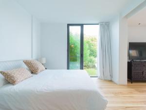 Łóżko lub łóżka w pokoju w obiekcie Salobre Villas Lagos