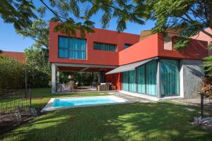 a house with a swimming pool in front of it at Salobre Golf Villas Premium in Salobre