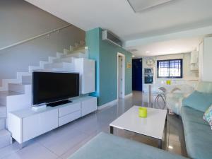 A television and/or entertainment centre at Meloneras Bay Suites