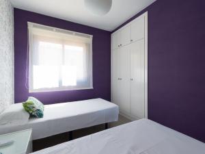 A bed or beds in a room at Meloneras Bay Suites