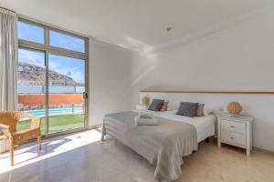 Ein Bett oder Betten in einem Zimmer der Unterkunft Tauro Villas Deluxe