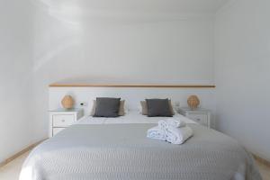 Ein Bett oder Betten in einem Zimmer der Unterkunft Tauro Villas Deluxe
