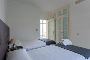 Ein Bett oder Betten in einem Zimmer der Unterkunft Tauro Villas Deluxe