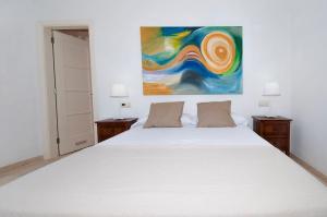 Ein Bett oder Betten in einem Zimmer der Unterkunft Tauro Villas Deluxe
