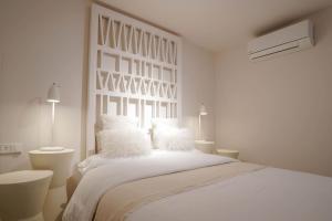 Posteľ alebo postele v izbe v ubytovaní Agustino Beach Suites San Agustin + 18 fotografií