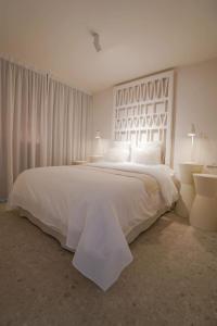 Posteľ alebo postele v izbe v ubytovaní Agustino Beach Suites San Agustin