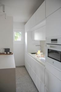 Kuchyňa alebo kuchynka v ubytovaní Agustino Beach Suites San Agustin