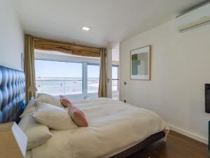 Postel nebo postele na pokoji v ubytování Oasis Villas Maspalomas