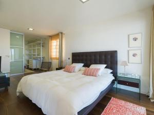 Postel nebo postele na pokoji v ubytování Oasis Villas Maspalomas