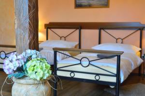 Posteľ alebo postele v izbe v ubytovaní Hotel Via Ironia