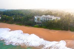 an aerial view of a resort on the beach at The Rockwall Boutique Hotel in Bentota