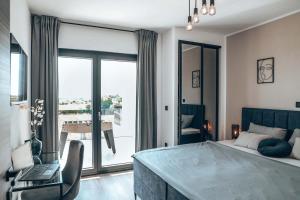 a bedroom with a bed and a desk with a laptop at Villa IVaLA in Pula +35 photos