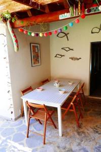 a white table and chairs in a room at Wonderful Summerhouse in Fánai