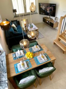 a living room with a table with food on it at Apartament w Dolince Nowy Sącz in Nowy Sącz