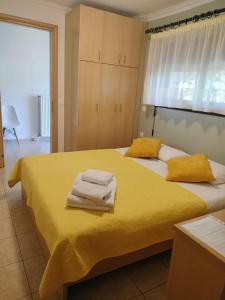 a bedroom with two beds with towels on them at Studios Anassa in Skala Potamias
