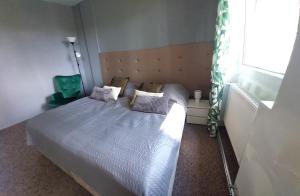 Säng eller sängar i ett rum på Dom Polonii w Żytkiejmach