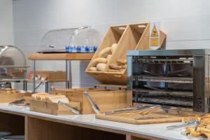 a bakery with pastries on a counter with a bakery at Plaza de la Luz Cádiz in Cádiz