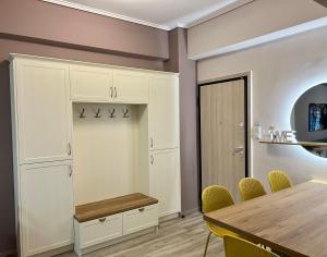 a dining room with a table and chairs at Loutraki apARTment in Loutraki