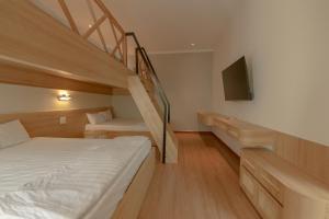 Postel nebo postele na pokoji v ubytování Tây Tiến Bungalow