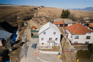 an overhead view of a white house in a village at Totina Apartments in Závažná Poruba