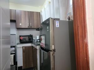 Kuchyň nebo kuchyňský kout v ubytování Cozy Apartment