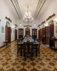 a large dining room with a table and chairs at amã Stays & Trails Palmeira de Saligao, Goa in Old Goa +22 photos