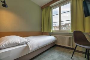 Postel nebo postele na pokoji v ubytování flexymotel Schönenwerd + 34 fotografií
