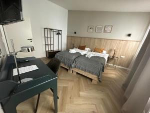 Ein Bett oder Betten in einem Zimmer der Unterkunft Aparthotel Lenau