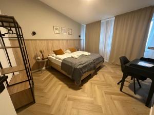 Ein Bett oder Betten in einem Zimmer der Unterkunft Aparthotel Lenau