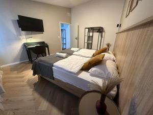 Ein Bett oder Betten in einem Zimmer der Unterkunft Aparthotel Lenau