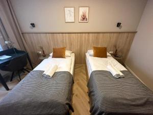 Ein Bett oder Betten in einem Zimmer der Unterkunft Aparthotel Lenau