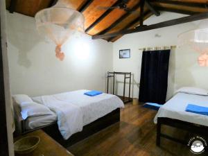 Postel nebo postele na pokoji v ubytování Bardia Homestay Pvt. Ltd.
