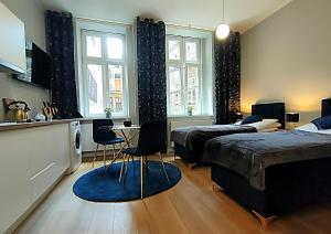 Posteľ alebo postele v izbe v ubytovaní Hugo Star Apartments