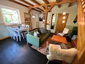 a living room with a couch and a table at Ferienwohnung Gänseweg in Graal-Müritz