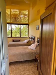 Cama ou camas em um quarto em Nor Takh