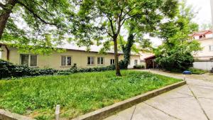 a house with a tree in the yard at CityNest Apartments in Krakow