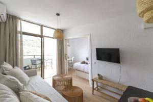 TV a/nebo společenská místnost v ubytování Apartamento Sunny Holidays