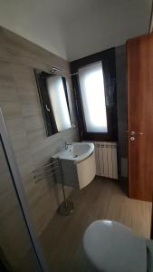 a bathroom with a sink and a mirror at Villa Saponaro - Affittacamere in Torre Lapillo +129 photos