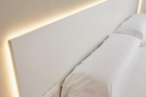 Postel nebo postele na pokoji v ubytování Hotel DL Port
